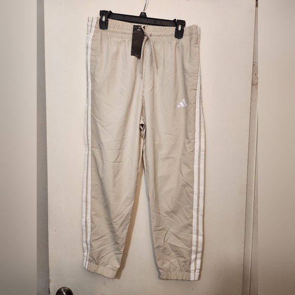 adidas Pants - Womens adidas essential 3 stripes woven 7/8 sportswear pants -M
